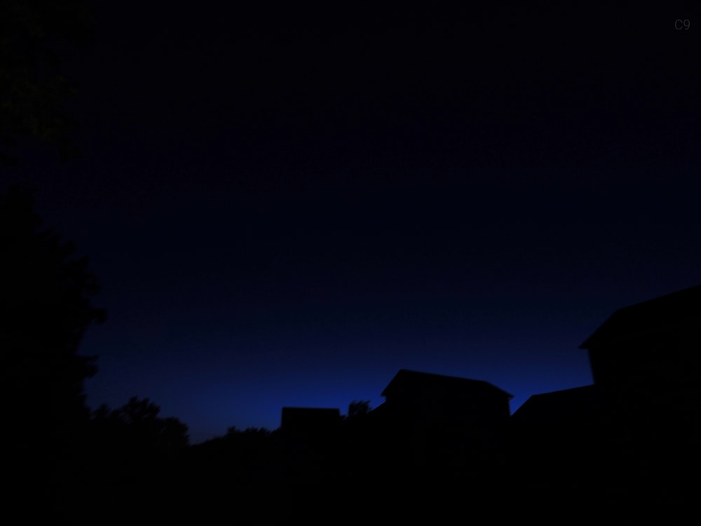 silhouette of buildings at night