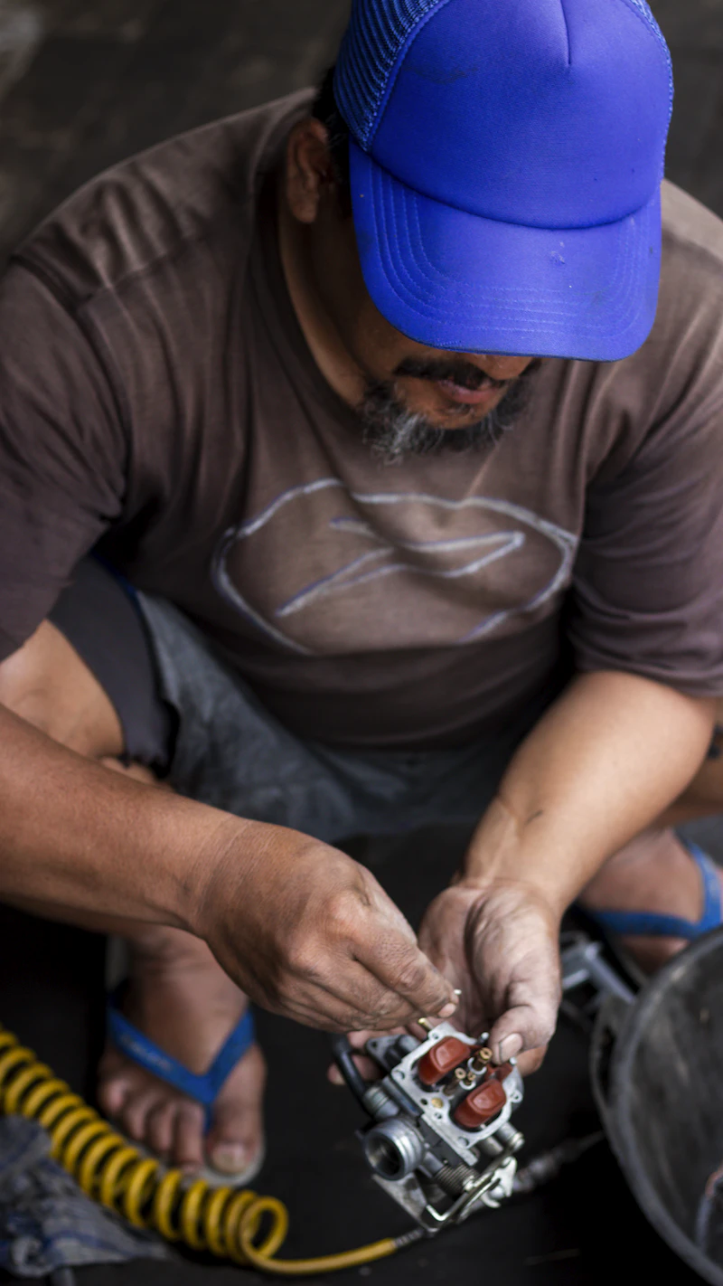 Repair technician fixing a plumbing valve