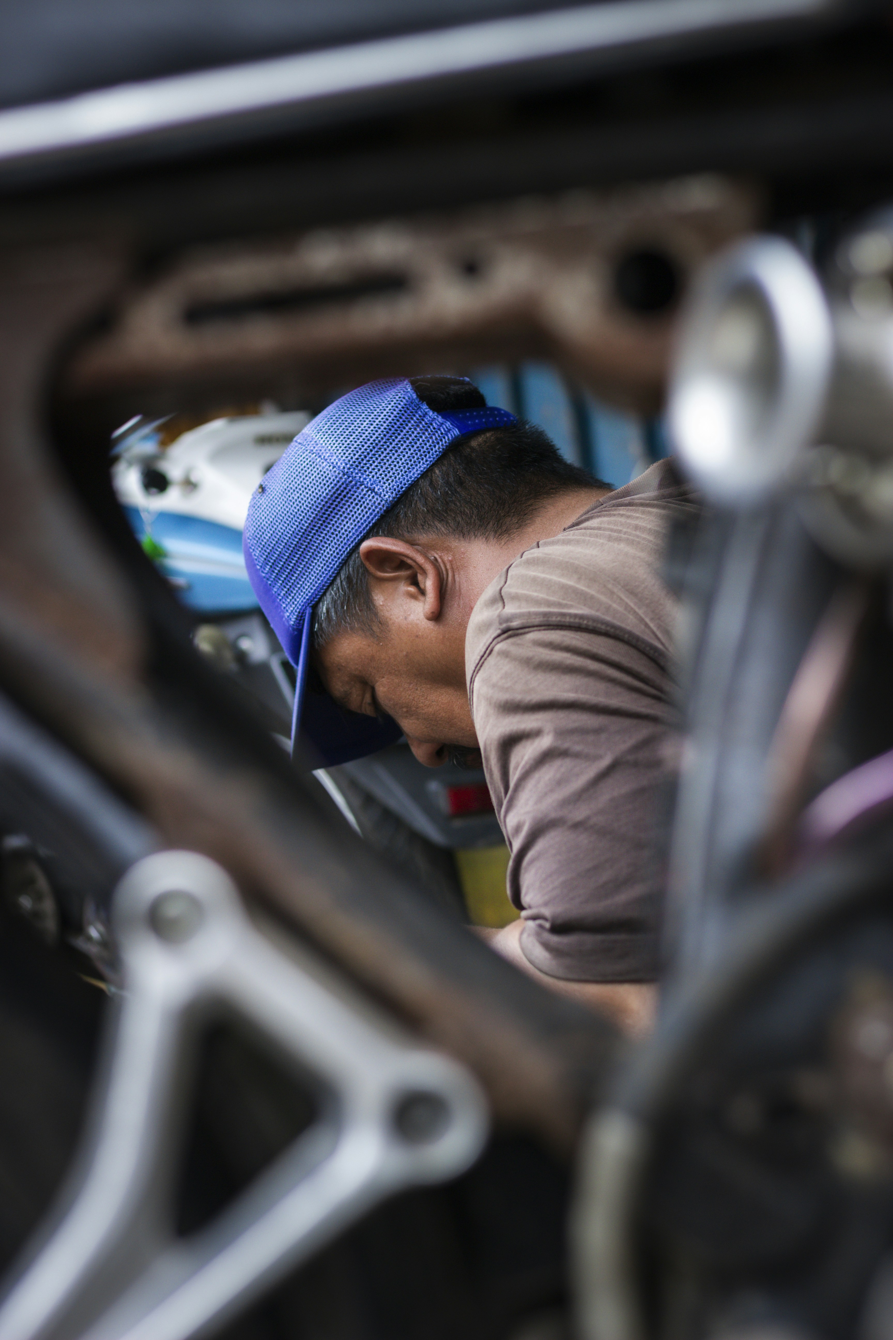 mechanic inspecting car