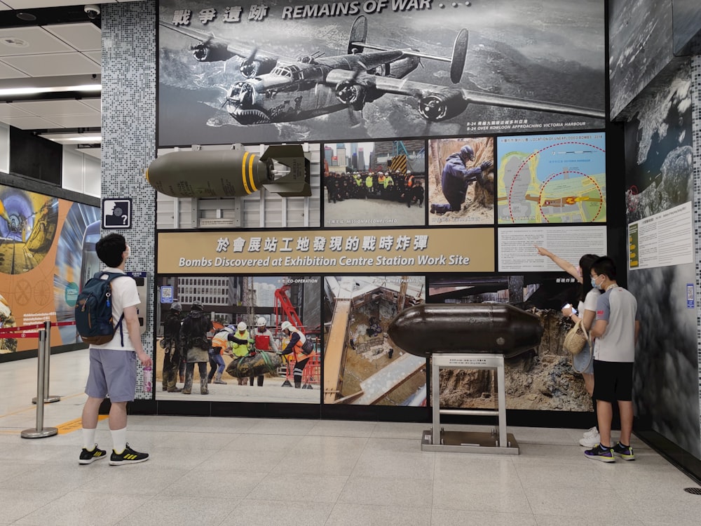 people looking at a poster