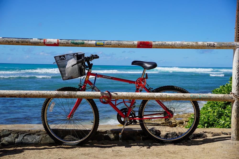 a bicycle parked on a beach