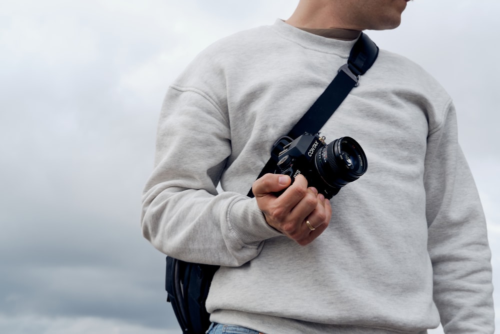 a man holding a camera