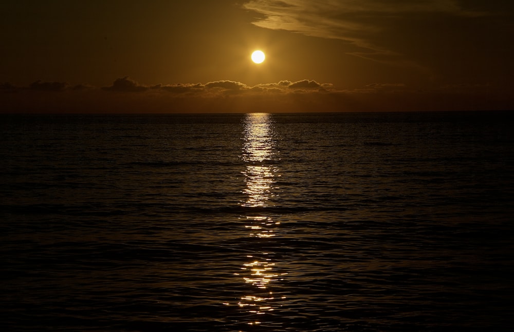 a sunset over a body of water