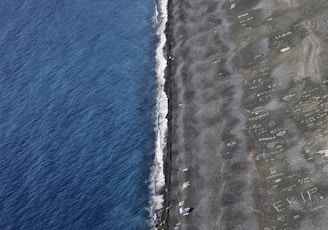 a plane flying over a beach