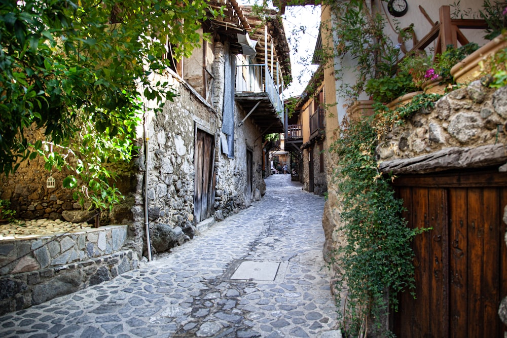 a stone street with buildings on both sides