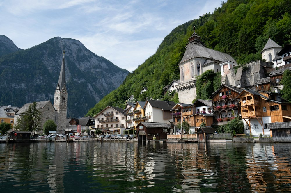 Hallstatt village on the edge of a lake in Austria's Salzkammergut region with mountains behind