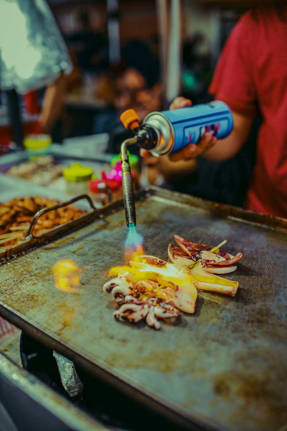 a person pouring a liquid into a bottle