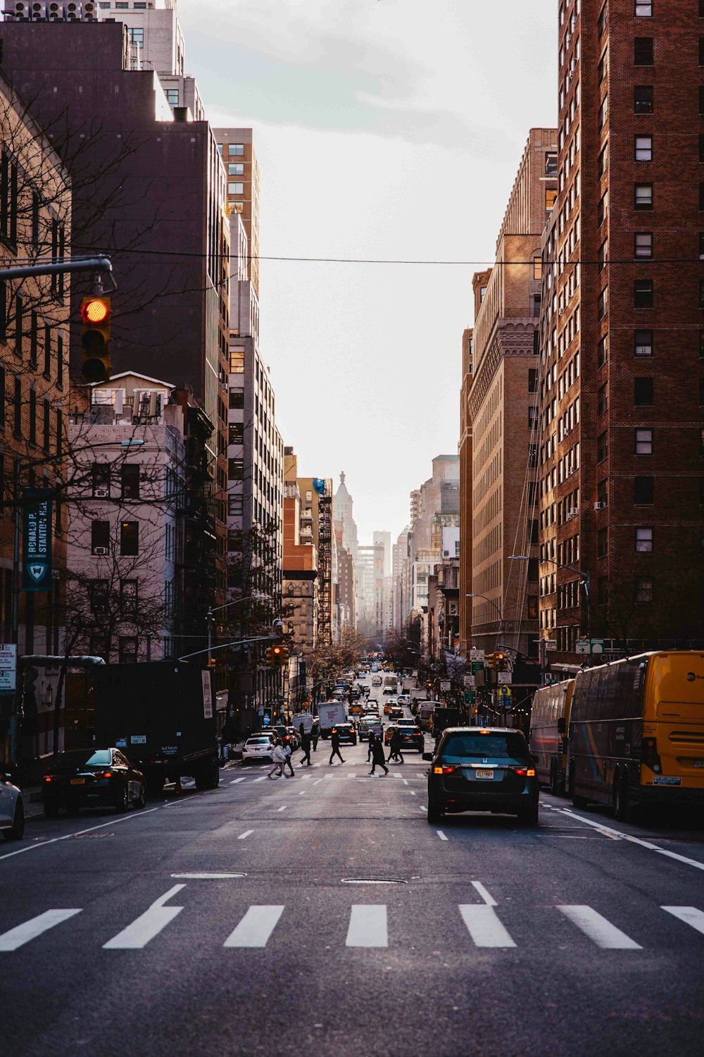 a city street with cars and people