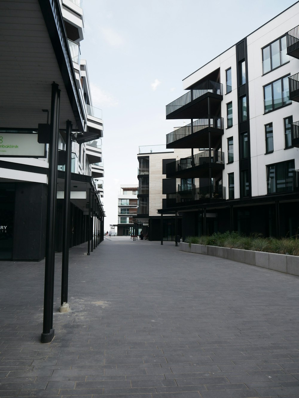 a brick road between buildings