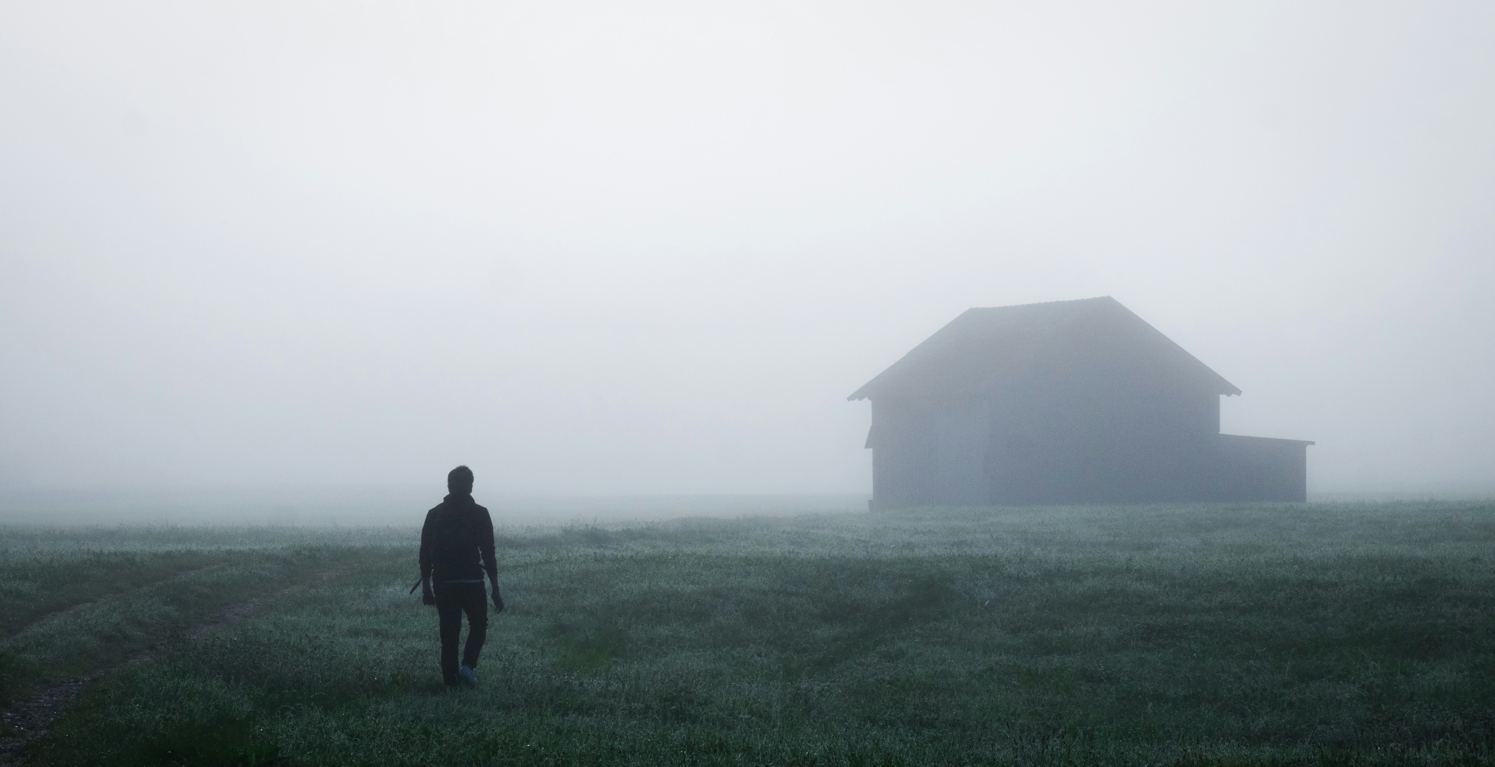 a man walking in a field