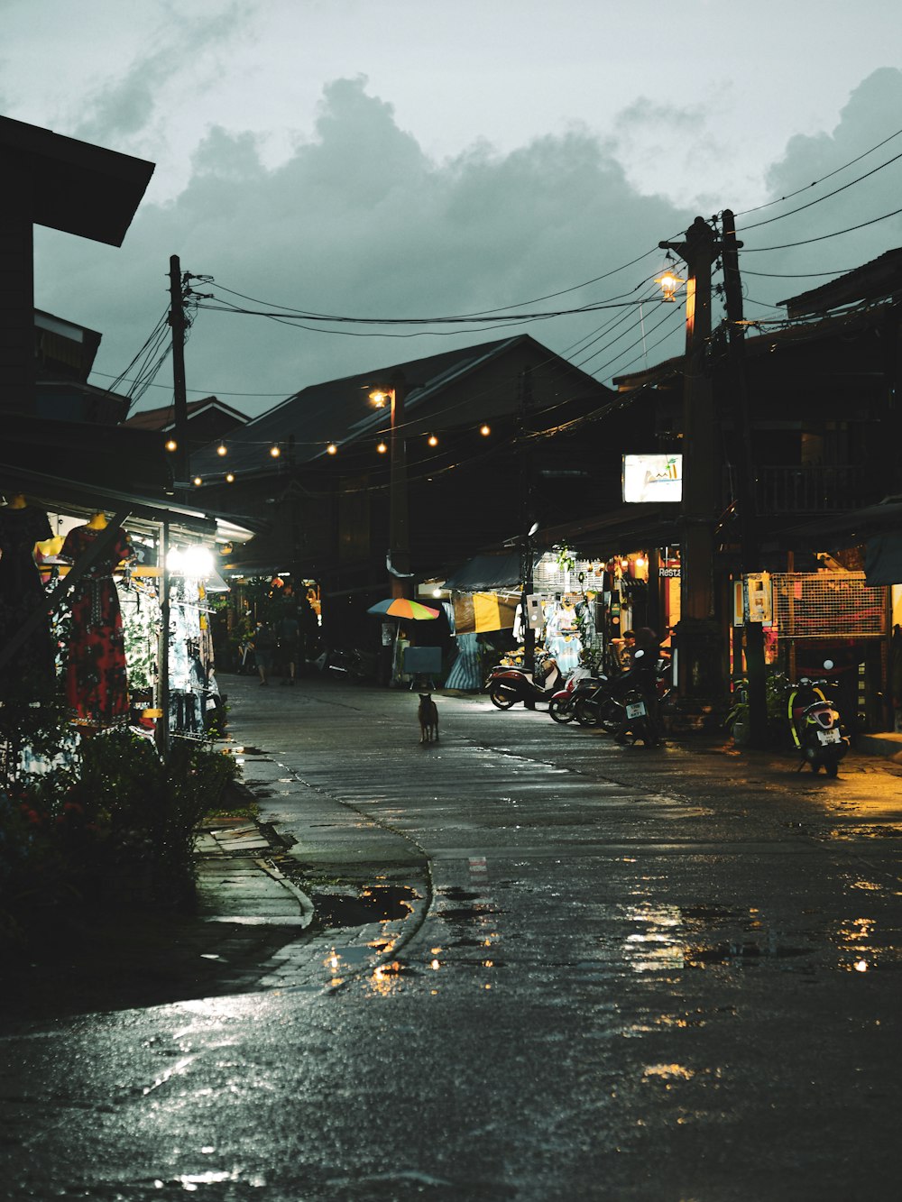 a street with buildings and people