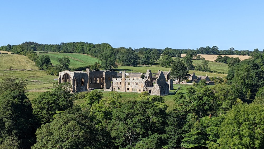 a large building surrounded by trees