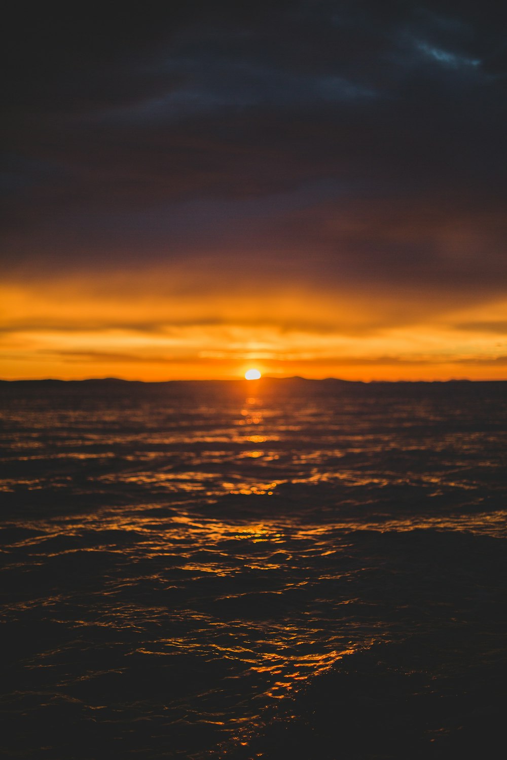 a sunset over a body of water