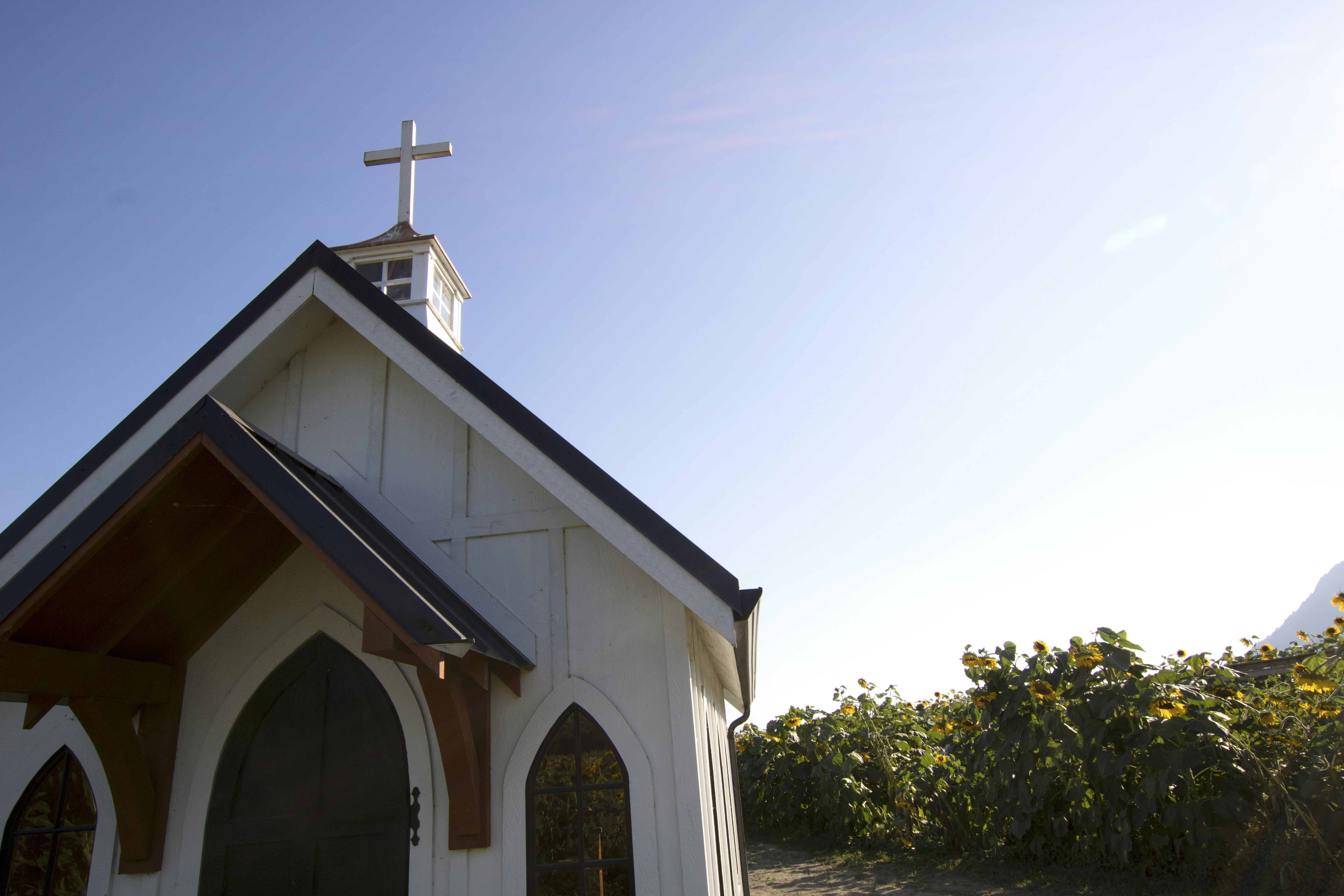 a white building with a cross on top