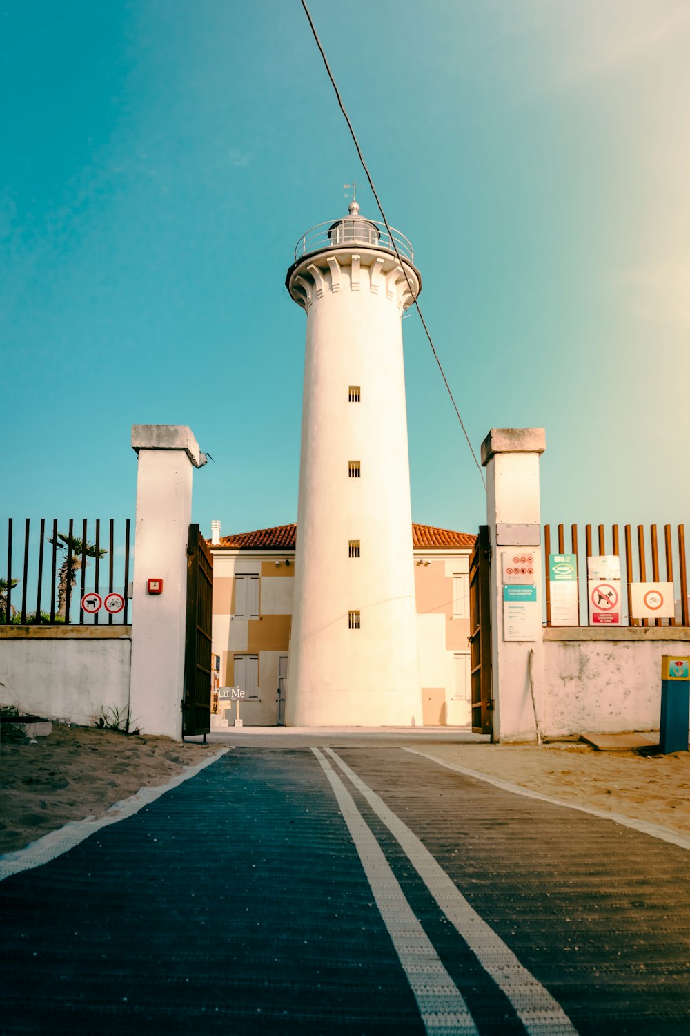 a white tower with a white top