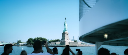 a statue of liberty and a bridge