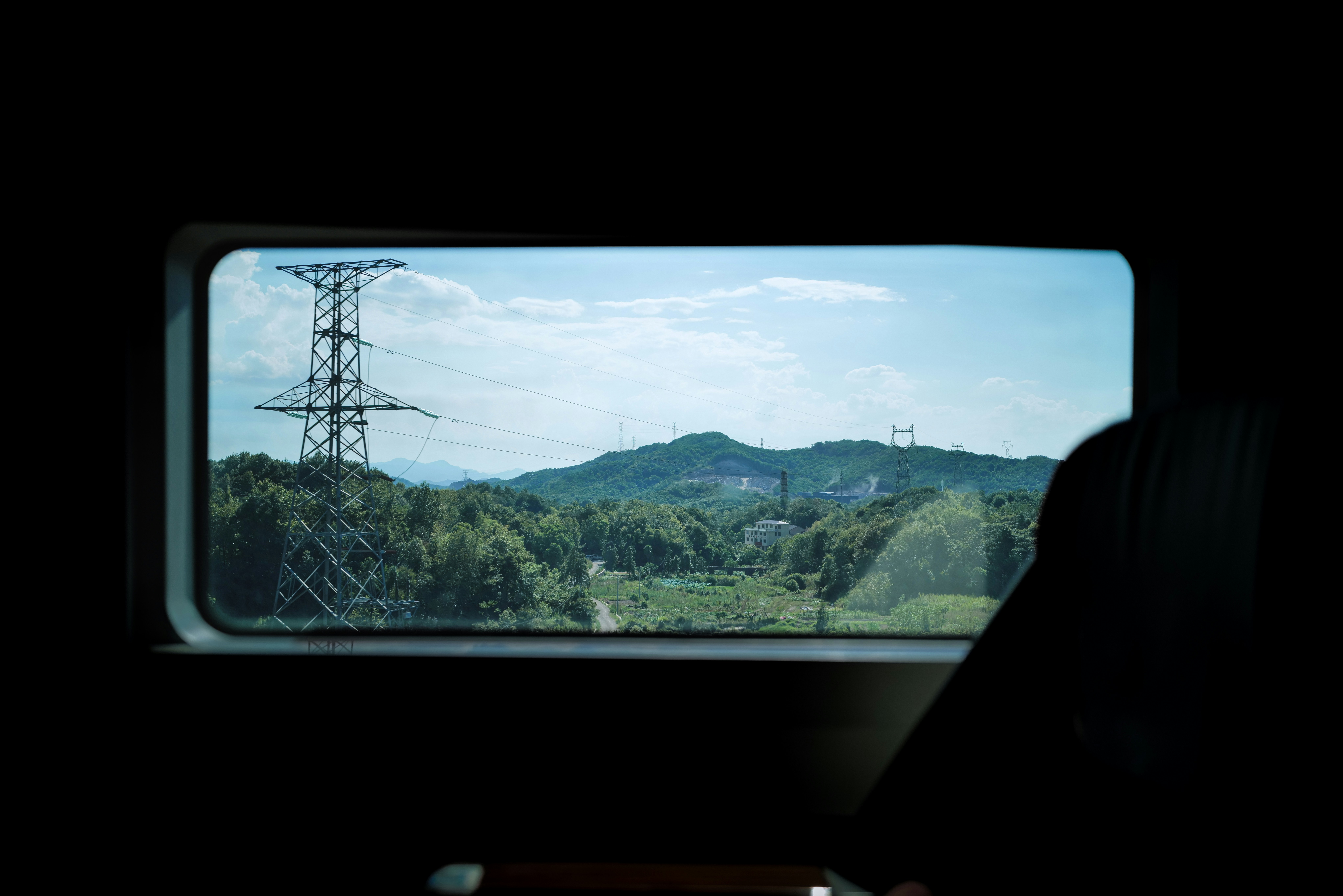 A view of a power line from a window photo – Free Blue Image on Unsplash