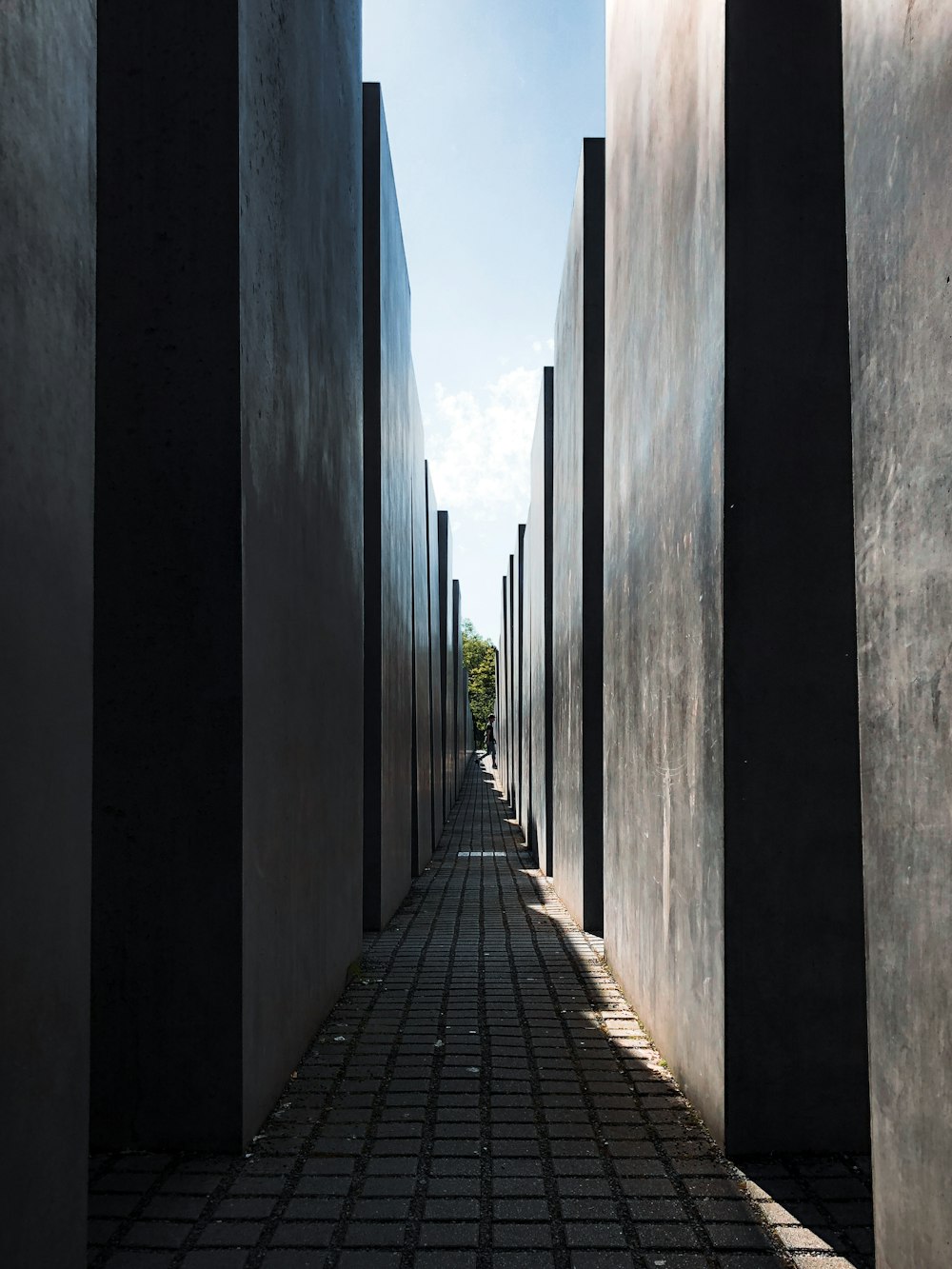 a walkway between two rows of pillars