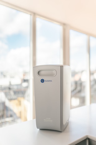 a white rectangular object with a blue logo on it