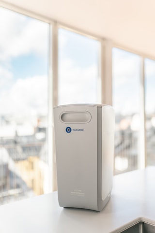 a white rectangular object with a blue logo on it