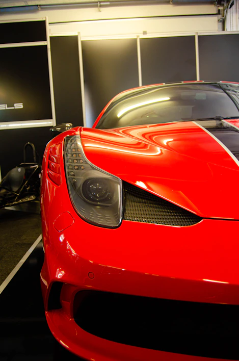 Close-up of sleek car accessories displayed on a modern showroom shelf.