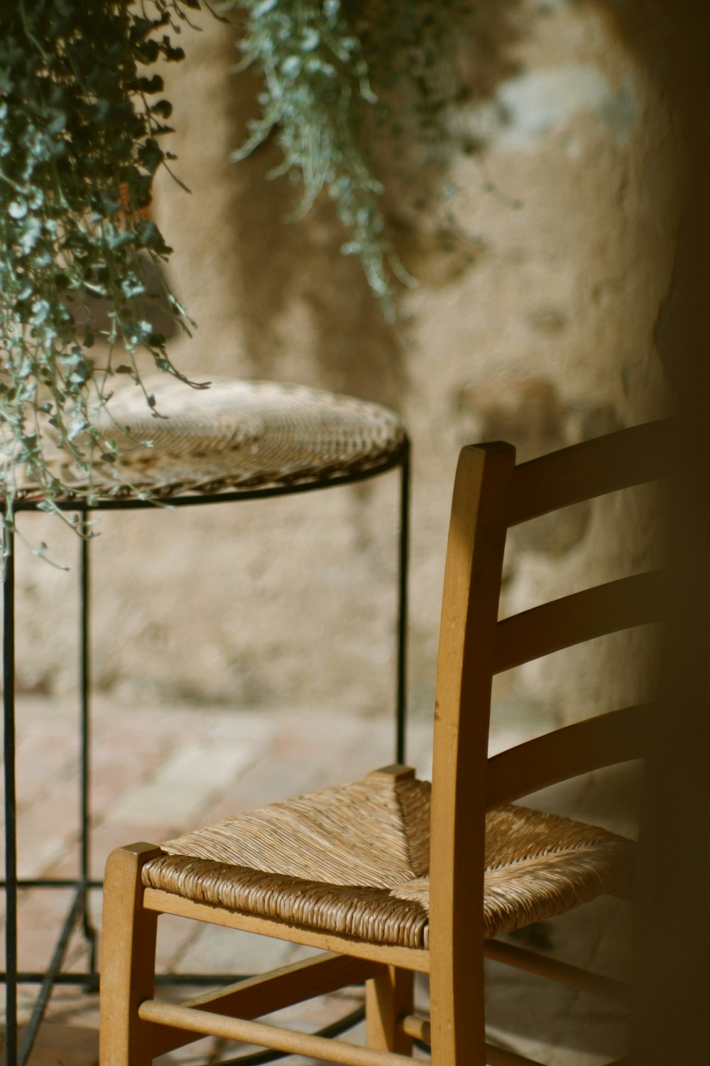 a chair outside with snow on the back