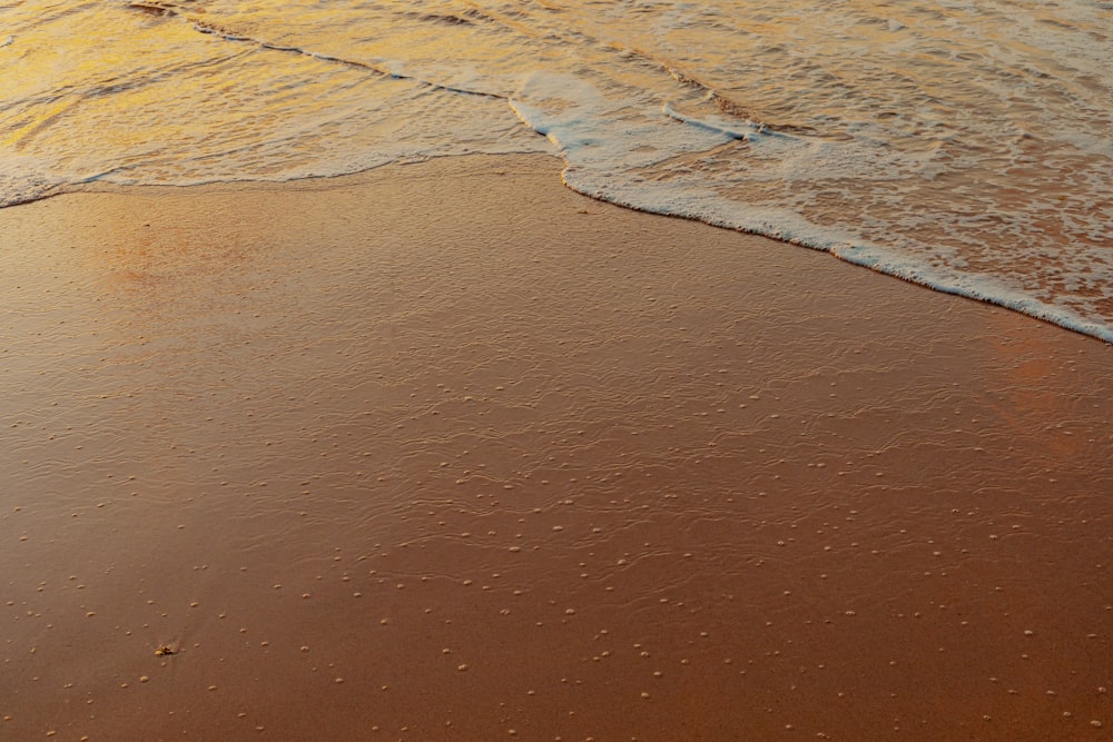 a sandy beach with a road