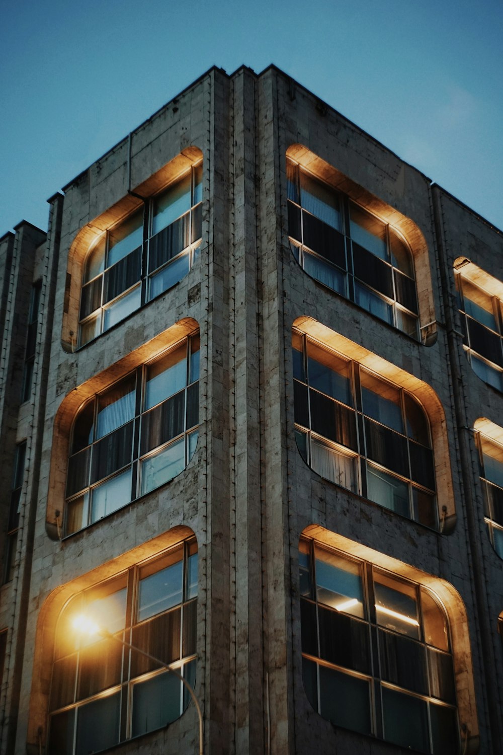 a train is parked on the side of a building