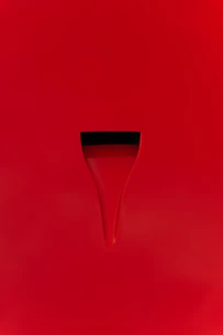 Clean minimalist logo design with a subtle red accent on a white background.