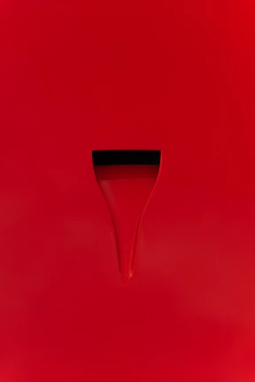 Classic red nails with a modern matte finish and minimalist design.