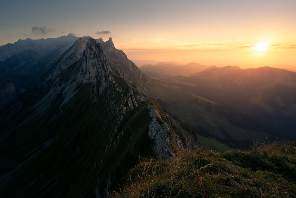 a mountain with a valley below