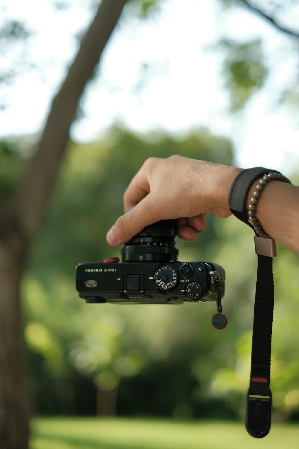 a hand holding a camera