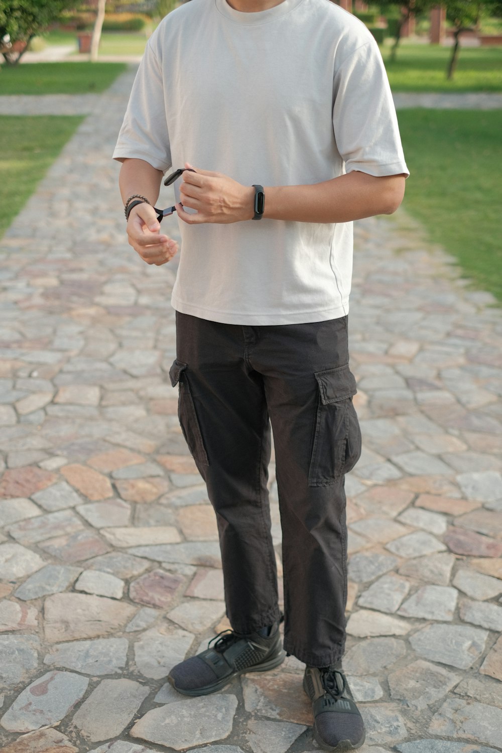 a man standing on a brick path