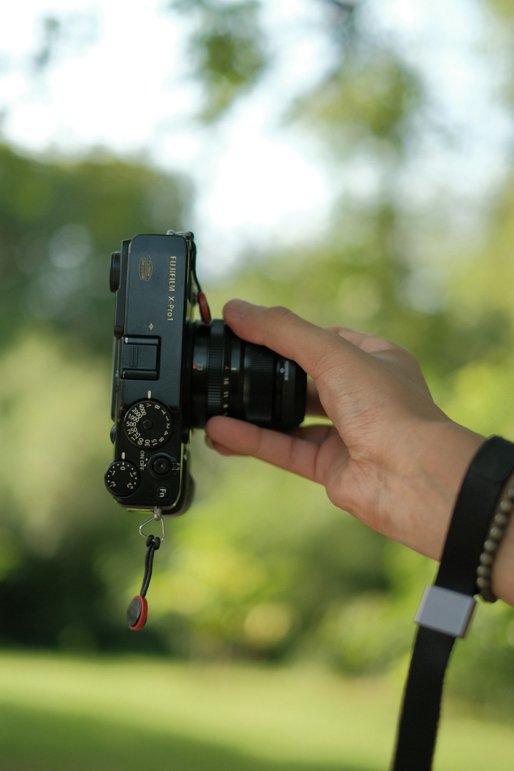 a hand holding a camera