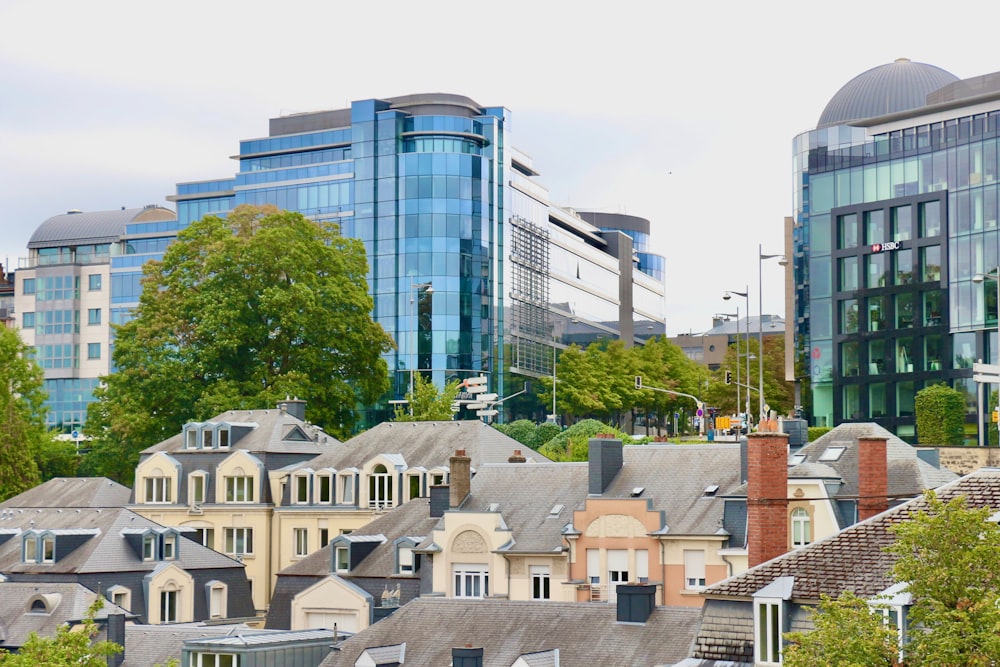 a group of buildings with trees in the front