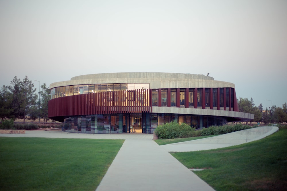 a building with a walkway and grass