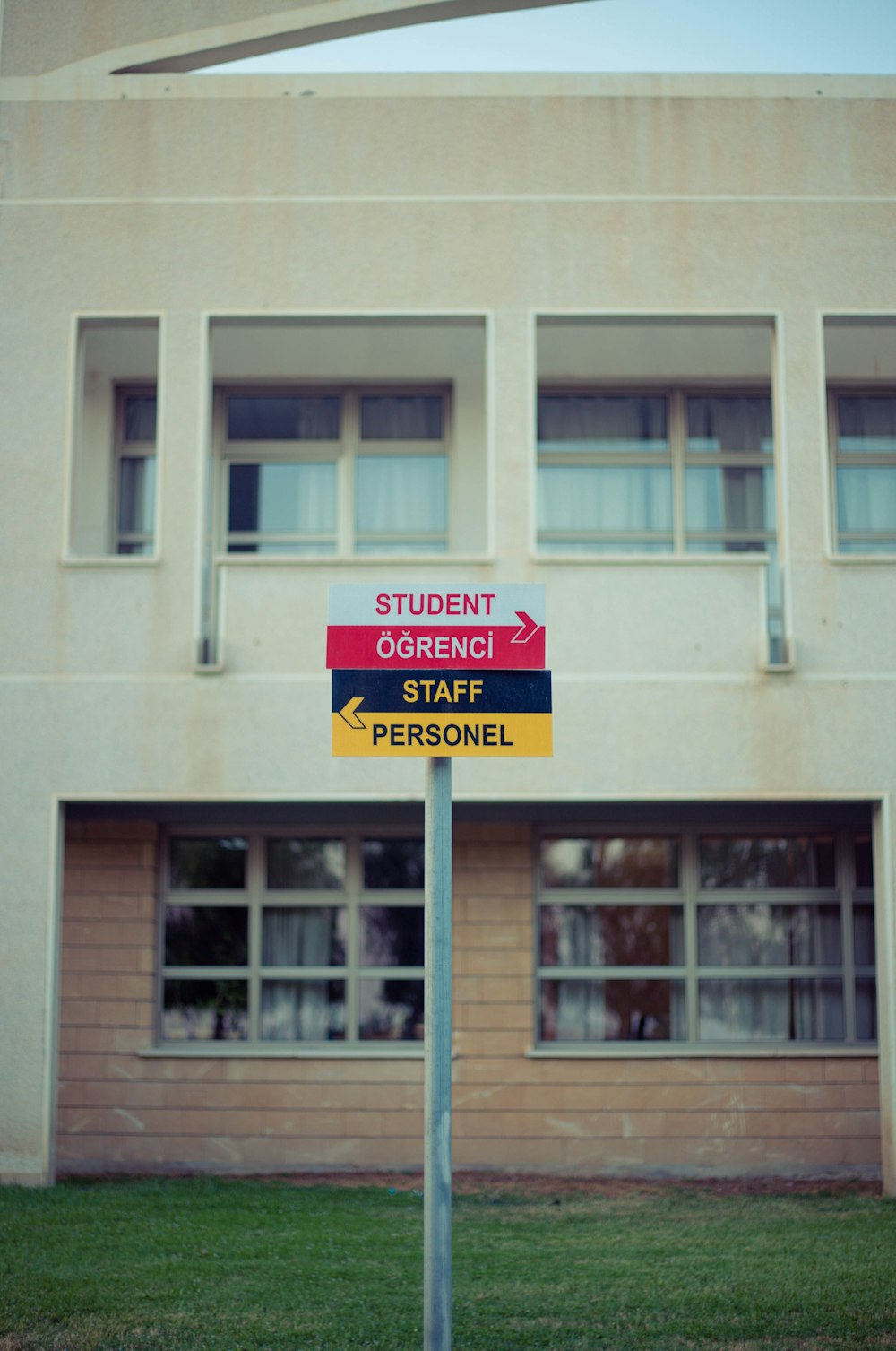 a sign in front of a building