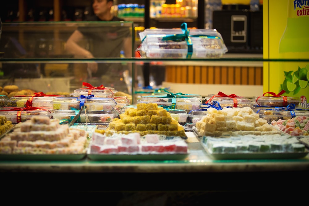 a counter with many cakes on it