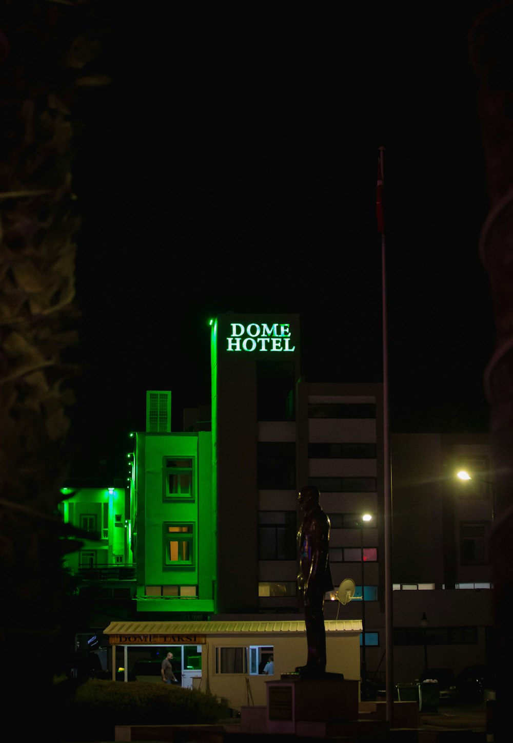 a statue in front of a building