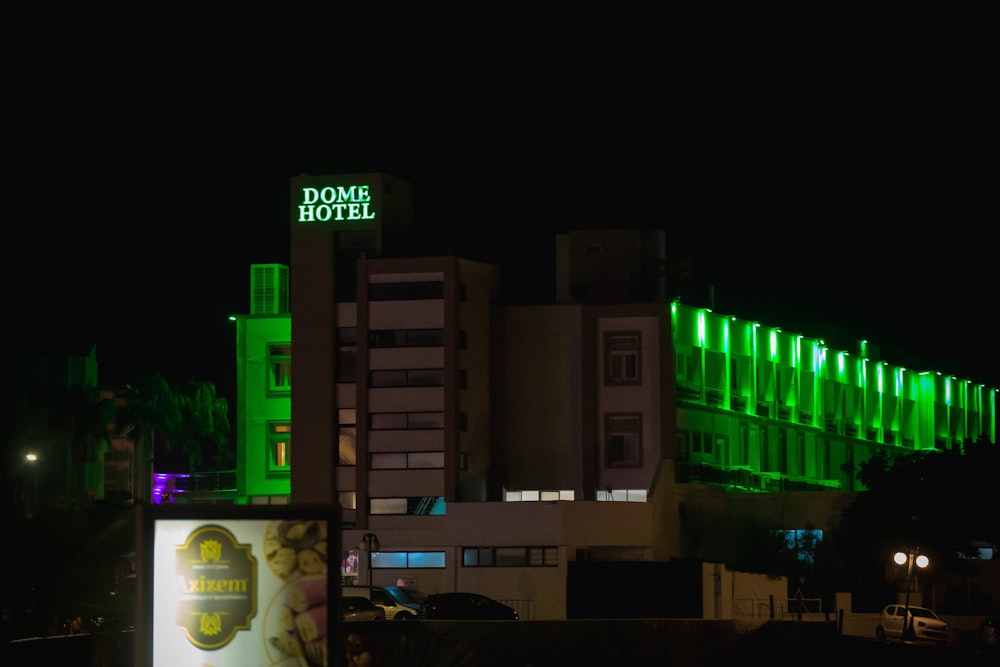 a building with neon signs at night