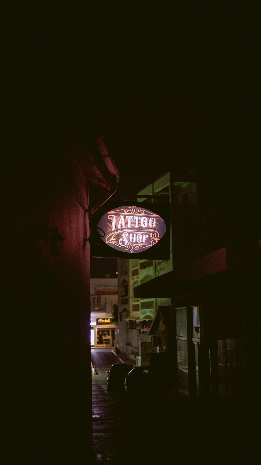 a neon sign on a street