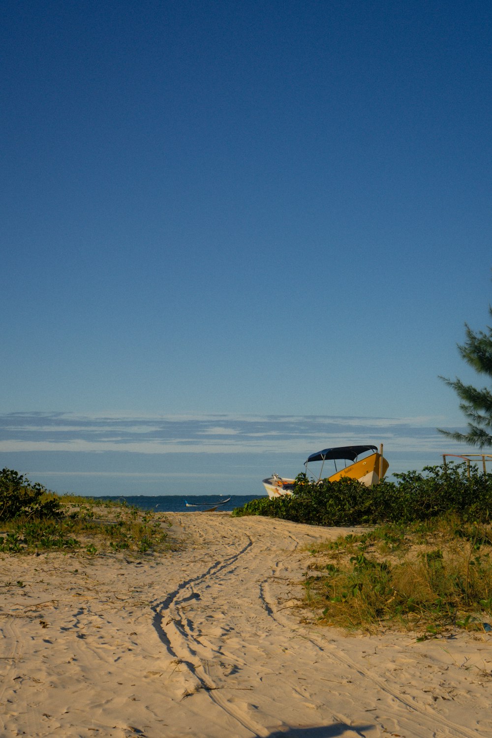 a boat on a sandy beach