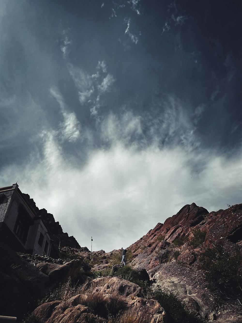 a house on a rocky hill