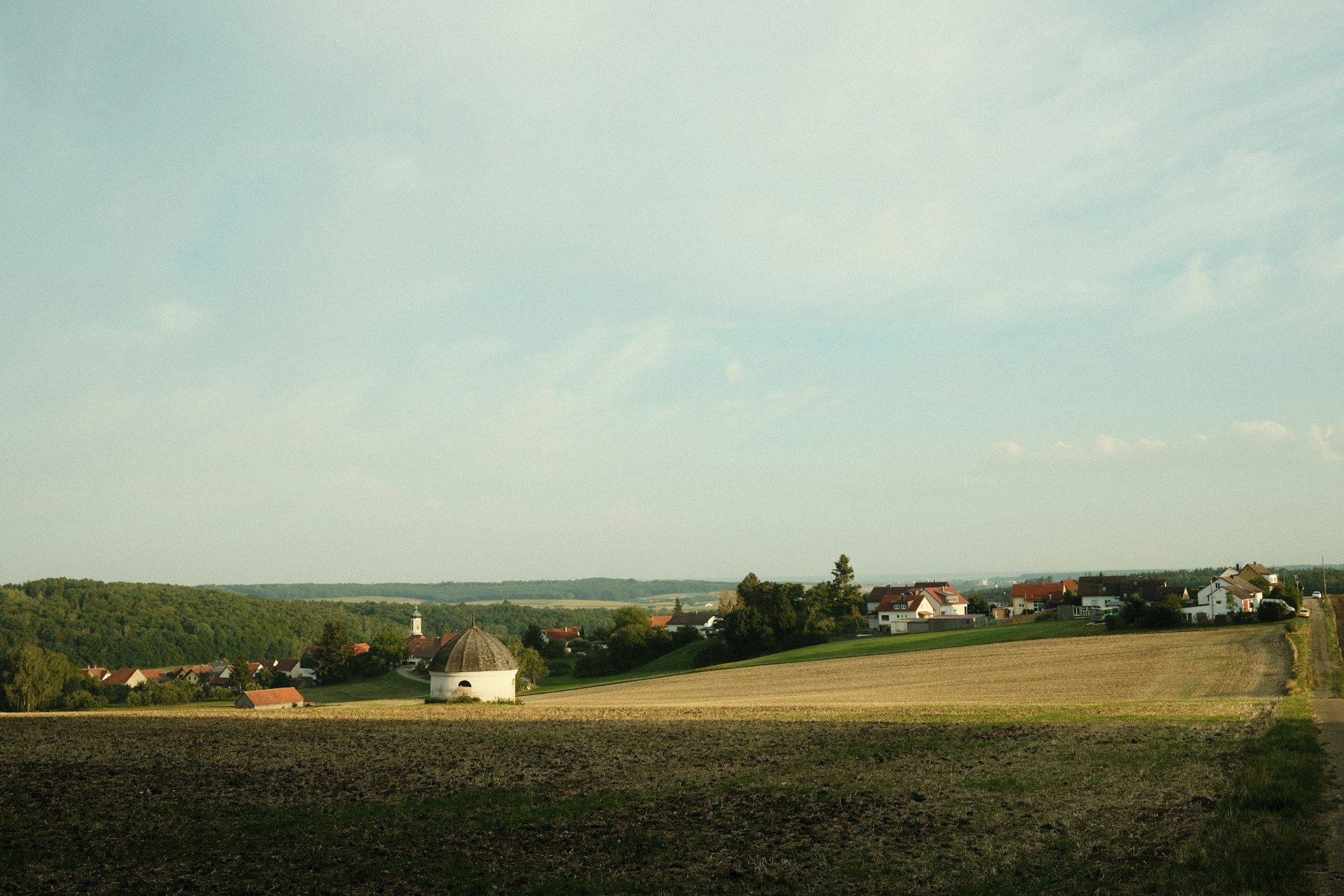 a field with houses in it
