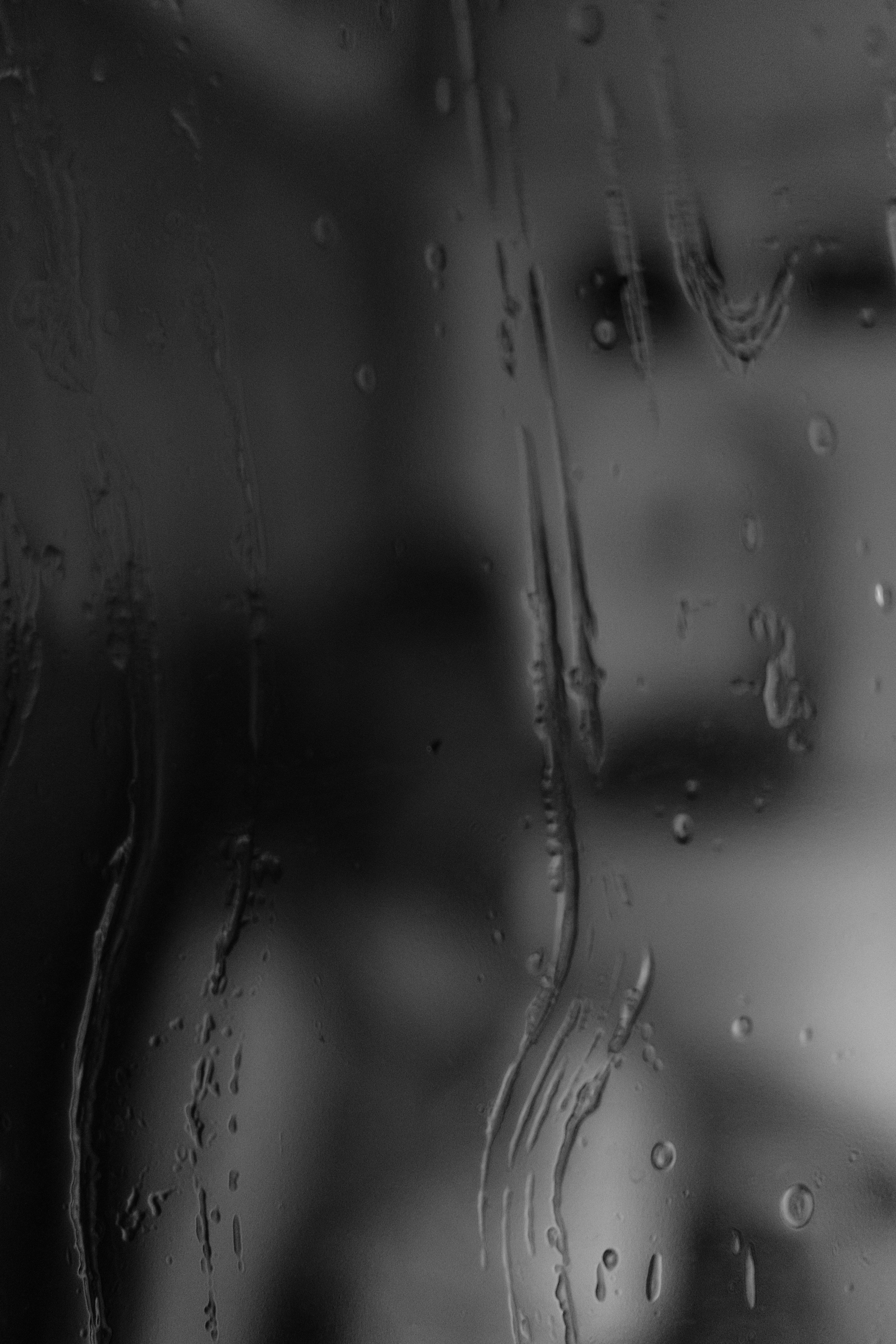 a close-up of water drops on a glass
