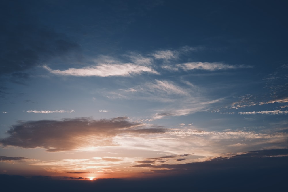 a sunset with clouds