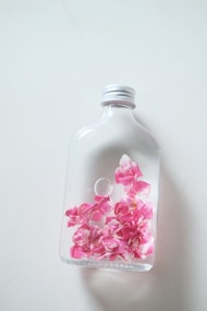a bottle with pink flowers