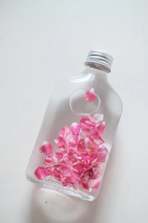 a bottle with a flower inside