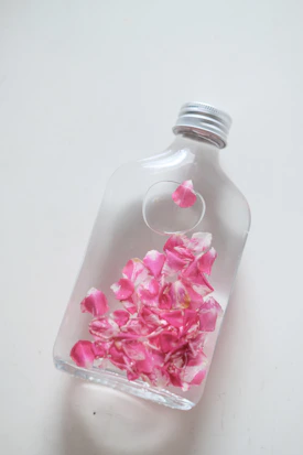 a bottle with a flower inside