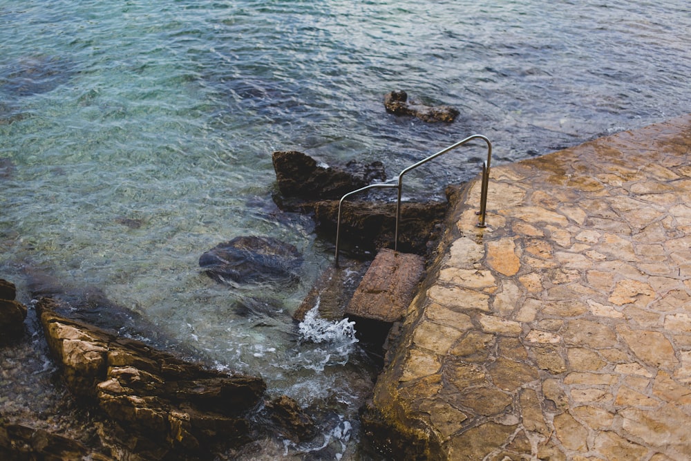 a stone walkway over water